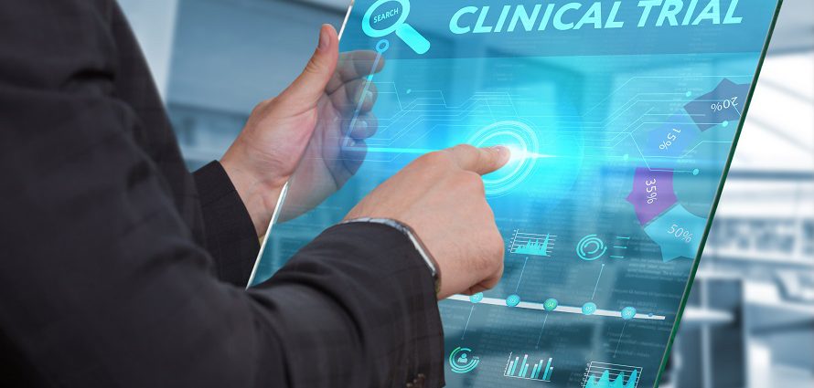 concept image of a doctor selecting a clinical trial from a tablet device