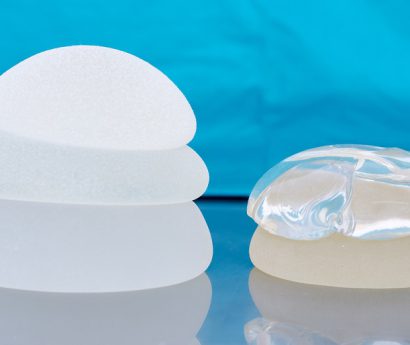 silicone and saline breast implants piled together