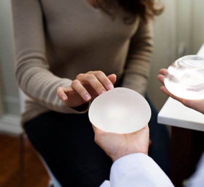 female patient choosing between breast implant types