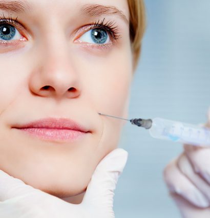 female patient getting cosmetic cheek injection