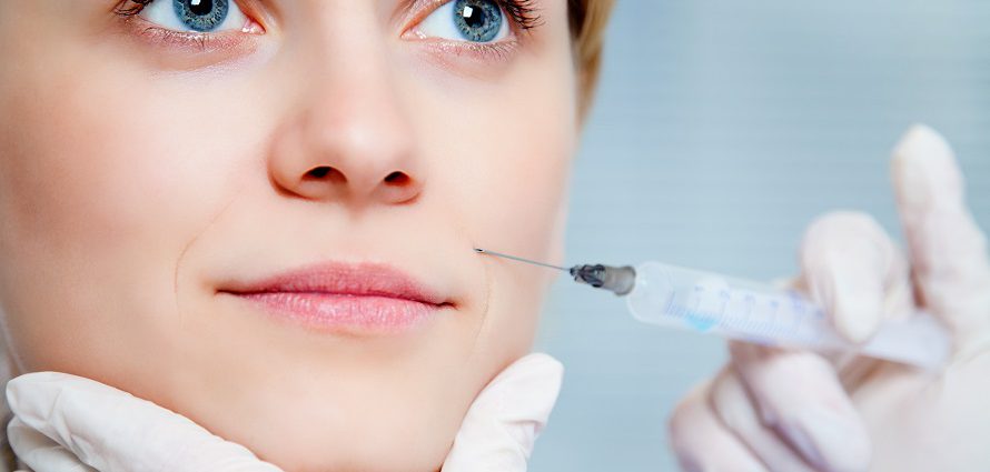 female patient getting cosmetic cheek injection