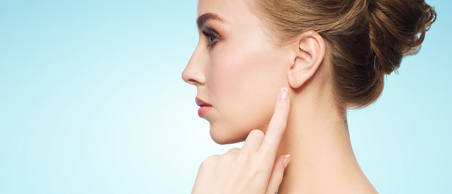 female model pointing at her earlobe