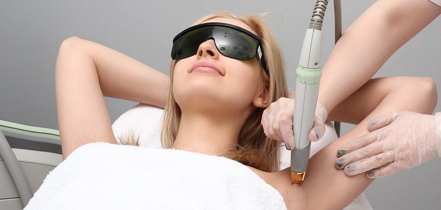 female patient receiving underarm laser hair removal