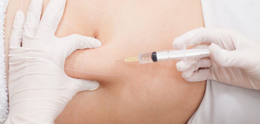 patient receiving an injection into an adbominal fat layer