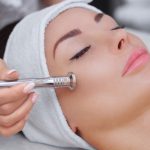 female patient receiving microdermabrasion treatment