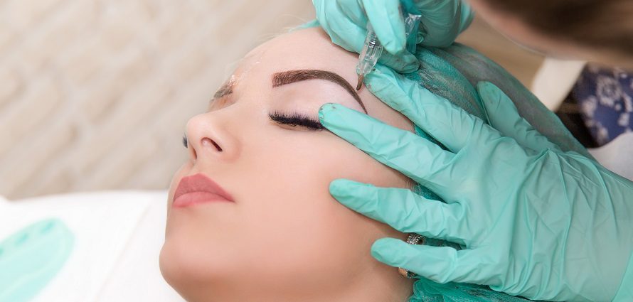 female patient receiving micropigmentation treatment