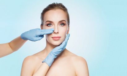 doctor evaluating the nose of a female patient at consult