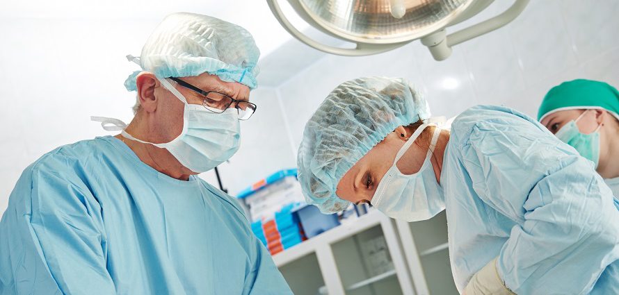 surgeons operating on a patient